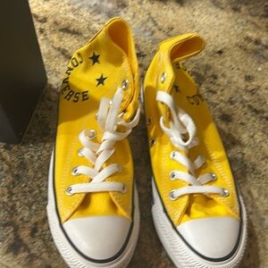 Bright yellow converse women’s high tops 
Never worn 
New in box